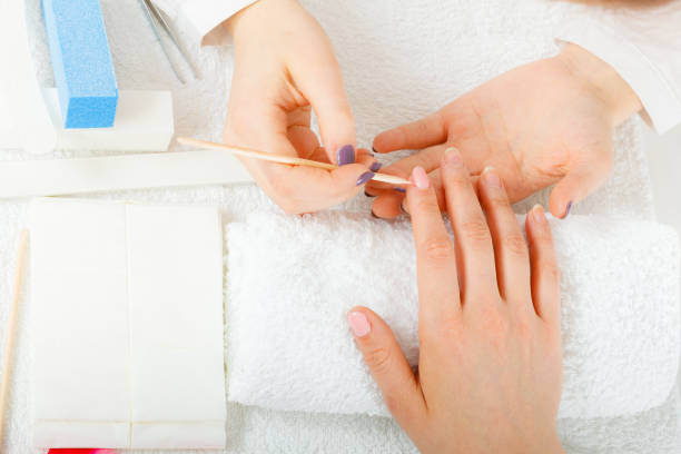 Effective methods for fixing nails following gel peeling, including nail buffer and hydrating cuticle cream
